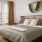 Large well lit bedroom with plush carpets and large windows 
