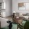 Spacious and well lit kitchen with wood flooring and stainless steel appliances