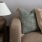 Spacious and well lit living room with wood flooring, large windows and open access to the kitchen