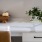 whiten desk with a plant on it